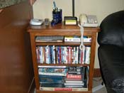 Bookcase of games and more than 100 DVDs